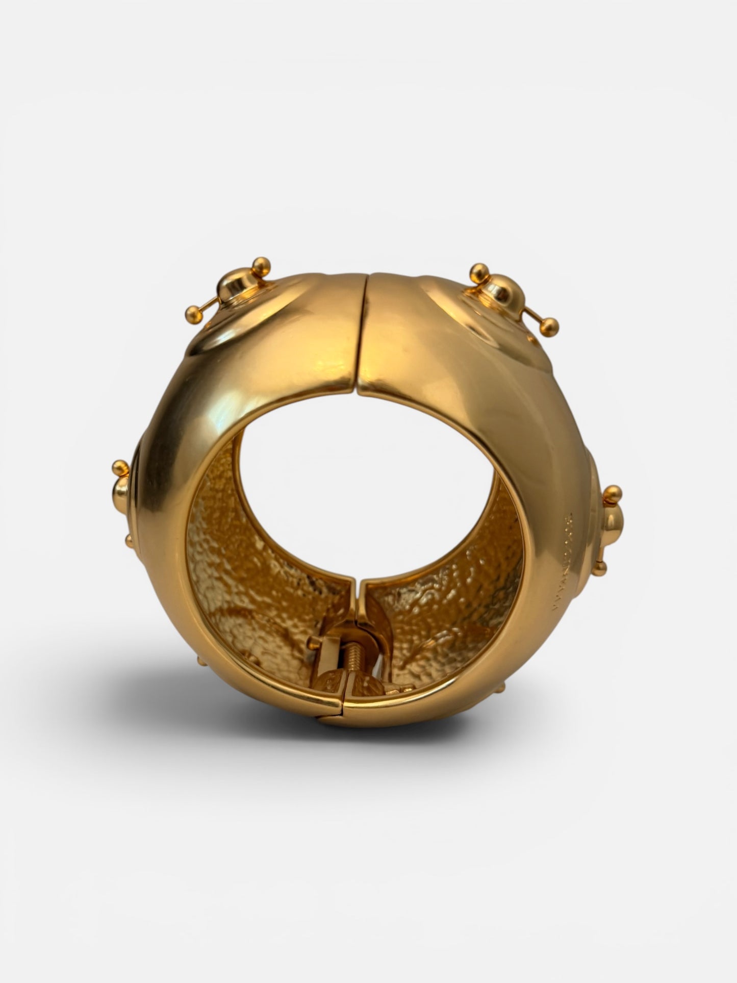 Hammered Gold bracelet with a unique nipple piercing design.