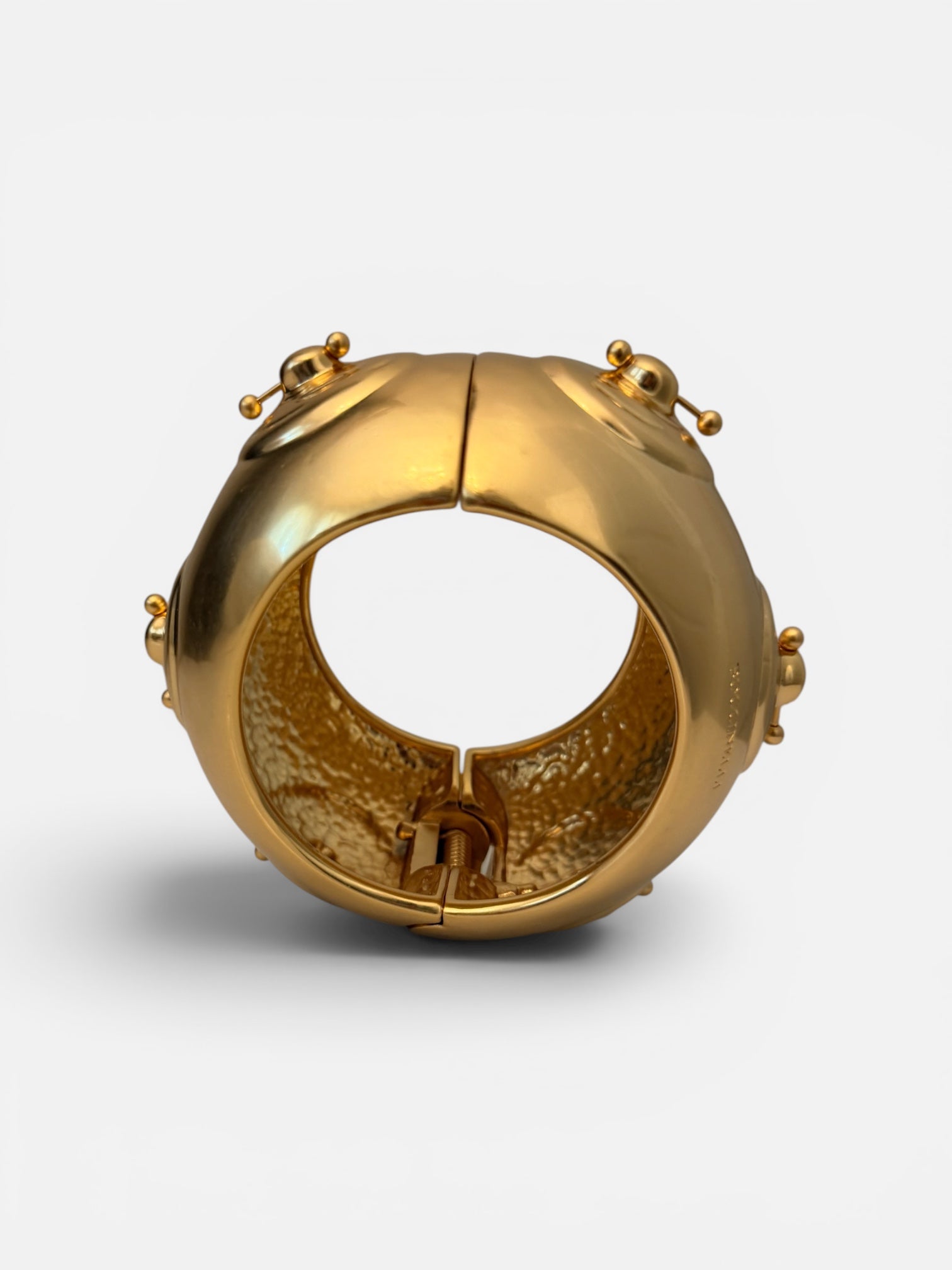 Hammered Gold bracelet with a unique nipple piercing design.