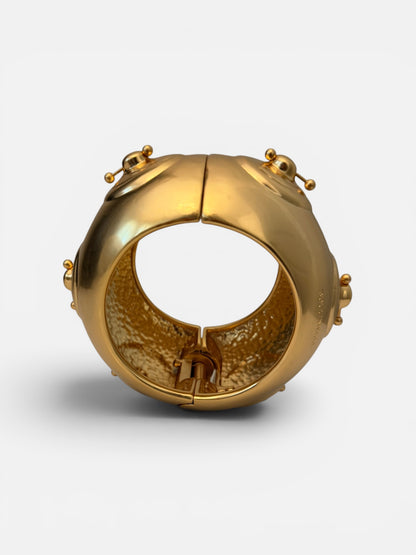 Hammered Gold bracelet with a unique nipple piercing design.