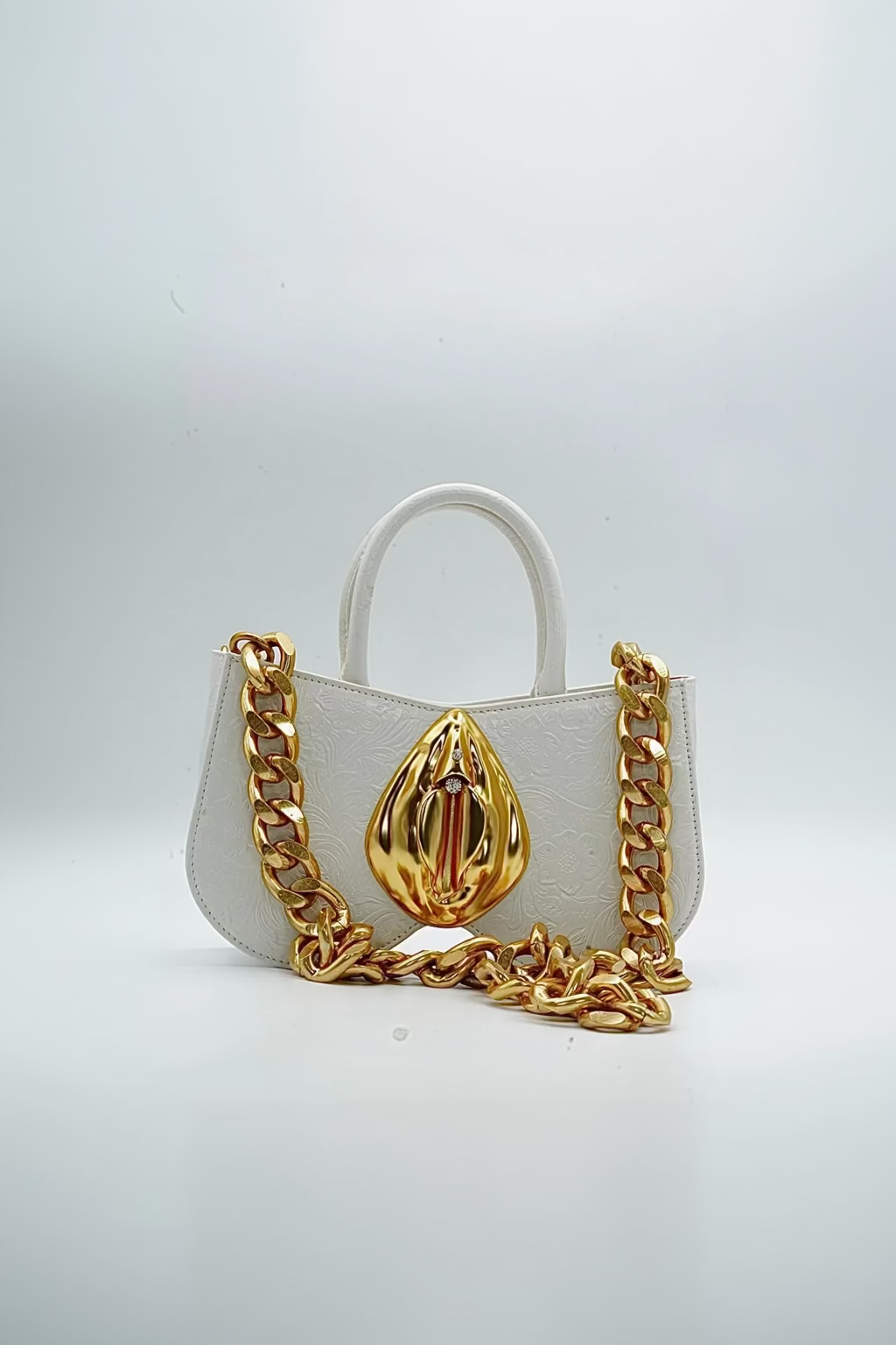 White leather, Gold Vulva